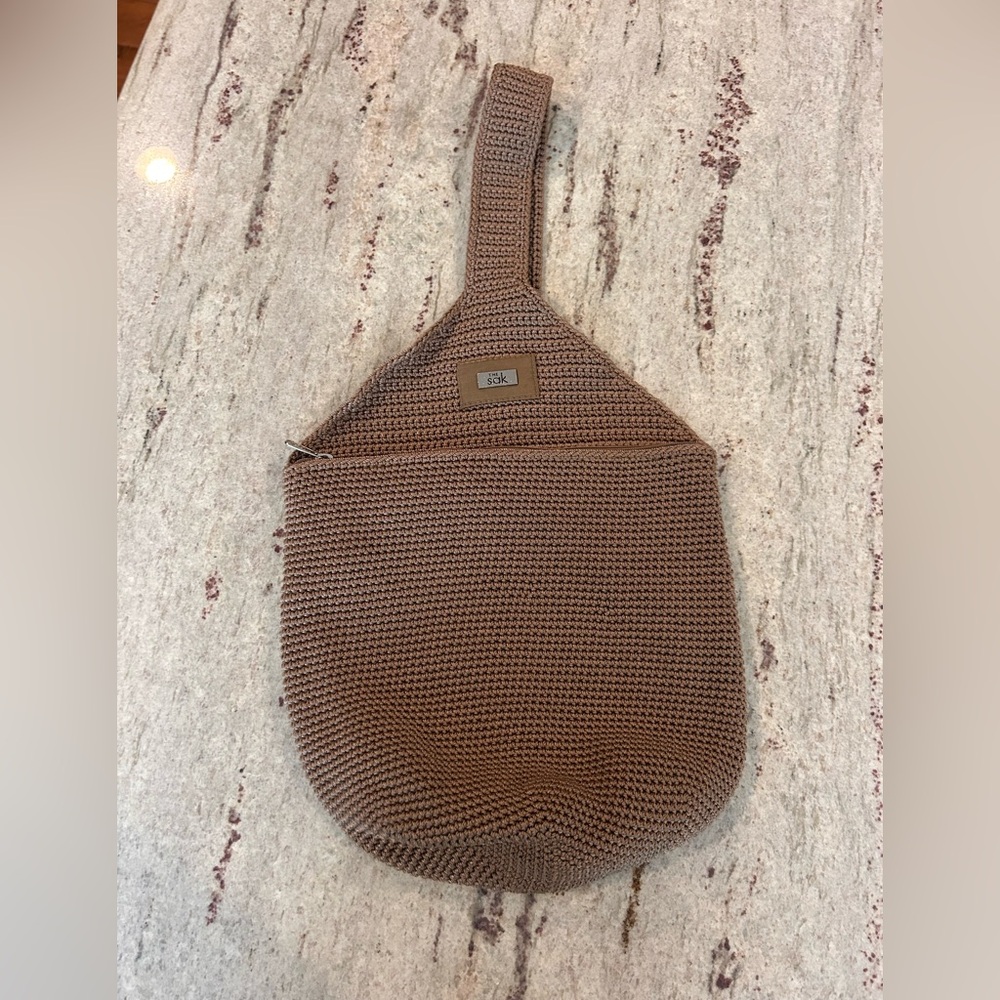 The Sak Brown Crochet Sling Backpack